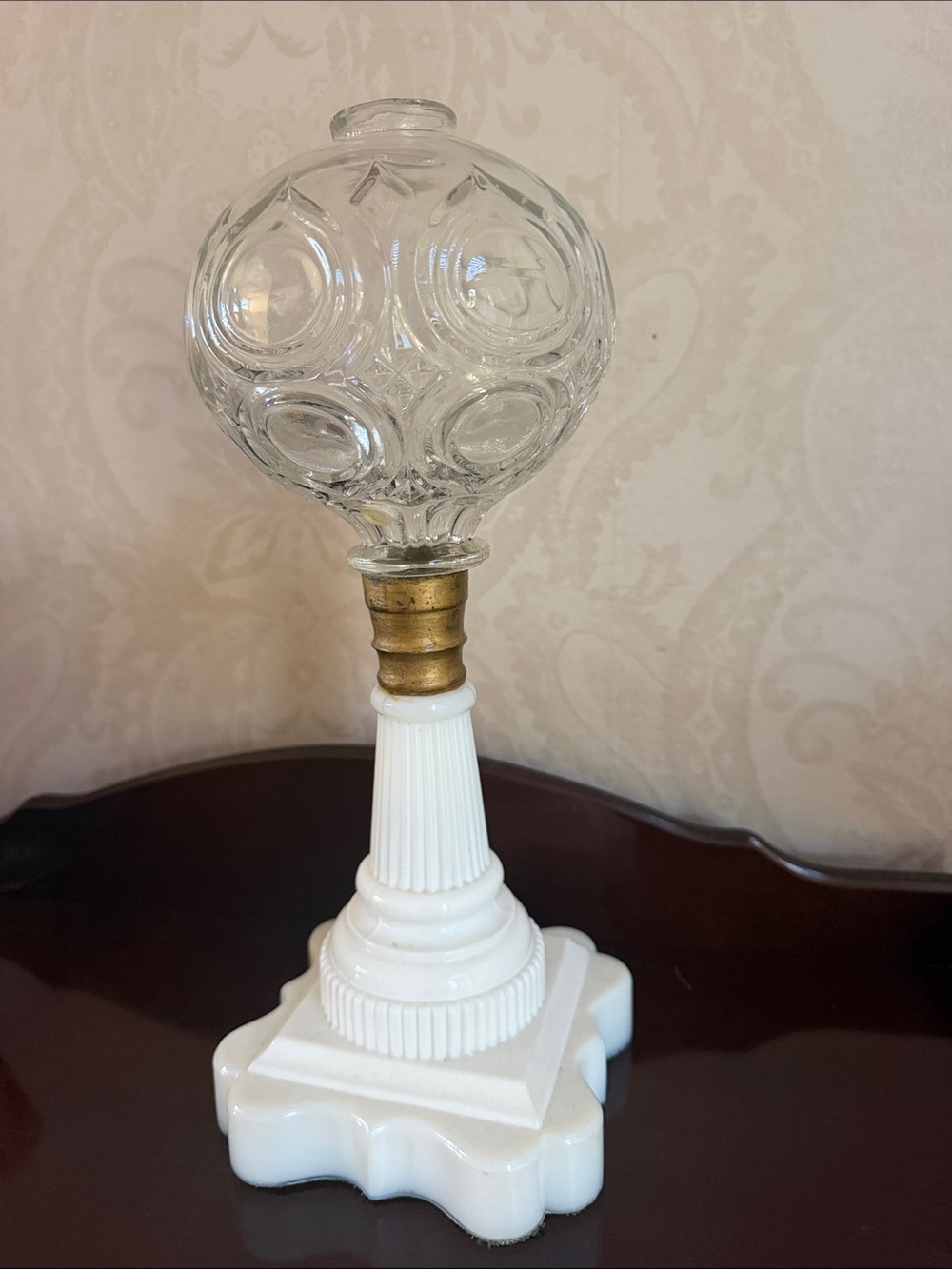 antique lamp features Bullseye glass and milk glass base